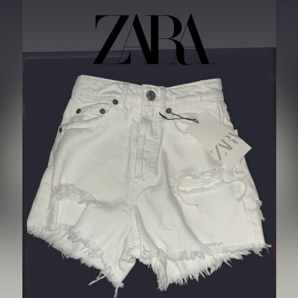Women’s- Zara Ripped Denim Shorts in white, featuring a high-rise fit. Size 0
